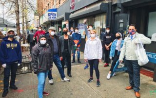 Brooklyn Community Foundation, members standing in a group on the sidewalk with masks on